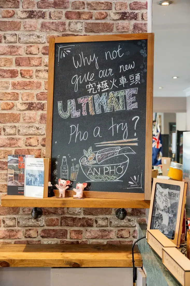 Chalkboard inviting guests to try the Ultimate Phở